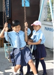 Sidiksha (left) has fun on a swing