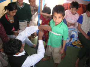 Being measured for school uniforms!