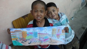 Dilip and Raoul showing their artwork